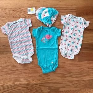 Set of three onesies with matching beanies